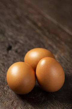 Brown chicken eggs rises on the table. Stock Photos