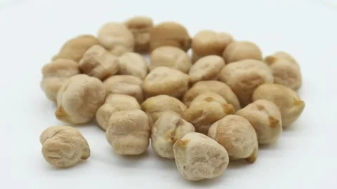 Brown chickpeas on white background 库存影片 141259574