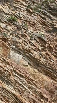 Brown cliff rock formations Textures and patterns backgrounds Stock Photos