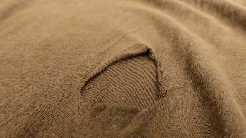 Brown cloth torn and damaged with holes. texture effect Stock Footage 314931502