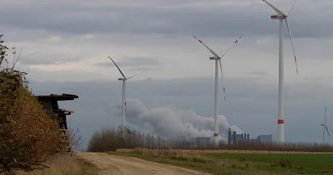 Brown coal power station with wind generators in Germany - UHD 4K Stock Footage 82656007