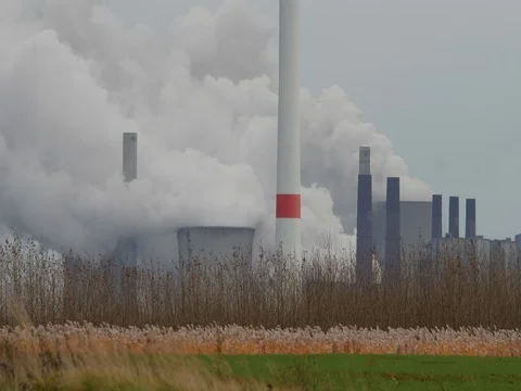 Brown coal power station with wind generators in Germany - UHD 4K Stock Footage 82656008