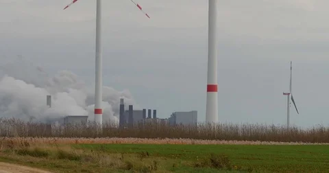 Brown coal power station with wind generators in Germany - UHD 4K Stock Footage 82656009