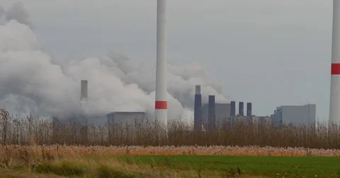 Brown coal power station with wind generators in Germany - UHD 4K Stock Footage 82656012