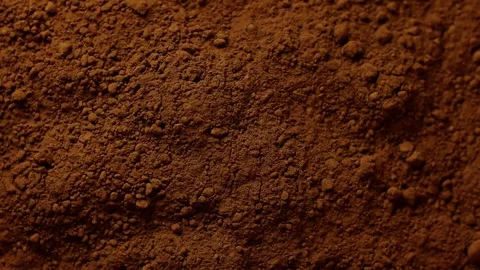 Brown cocoa powder texture with fine particles in close up detail. Stock Footage 323977309