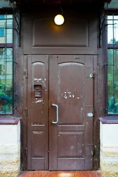 Brown coded door, old used dirty gate protected by code lock 스톡 사진