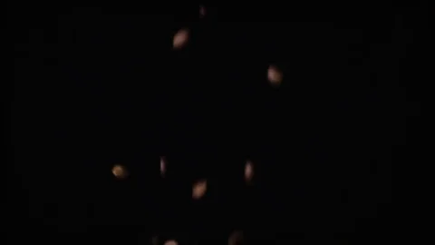 Brown coffee beans on a black background slow mo Stock Footage 73417264