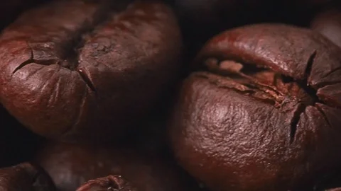 Brown coffee beans, extra close shot. Dolly shot of heap of roasted coffee beans Stock Footage 127474482