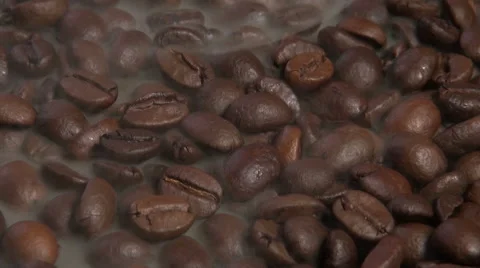 Brown Coffee beans with steam loop video HD Stock Footage 59305312