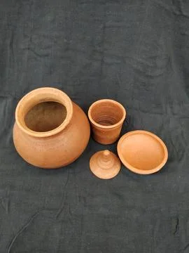Brown Color hand Made Empty Pot, Bowl and Glass with Lid isolated on a Blac.. Stock Photos