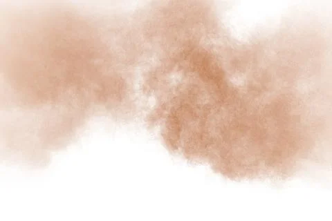 Brown color powder explosion cloud isolated on white background.Brown dust .. Stock Photos