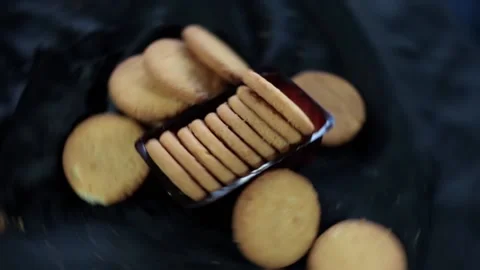 Brown-colored biscuits on a black surface, full Hd footage, 24 fps. Stock Footage 232215958