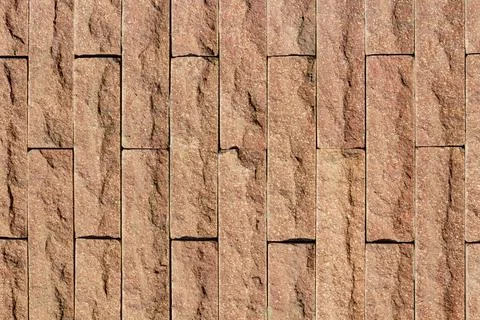Brown colored brick wall tile texture. Stock Photos