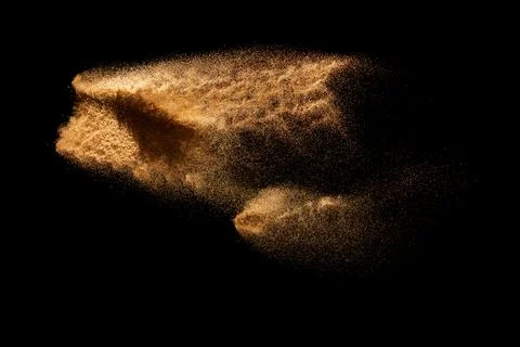 Brown colored sand splash.Dry river sand explosion isolated on black backgr.. Stock Illustration