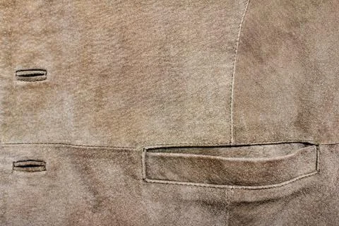 Brown colored suede material jacket texture. Stock Photos