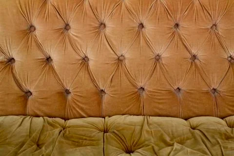 Brown couch background texture with sunken buttons Stock Photos