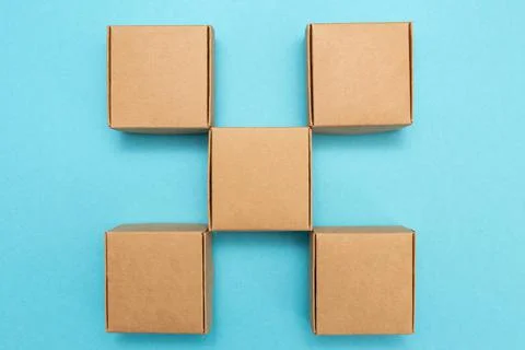 Brown craft boxes on colored background. Boxes for the delivery of goods, gifts Stock Photos