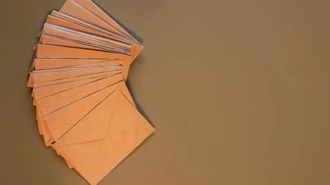 Brown craft envelopes on a gray background Stock Photos