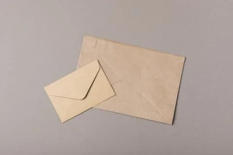 Brown craft envelopes on gray backgrounds Stock Photos