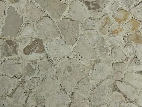 Brown cream stone wall texture which is usually installed on the walls of h.. Stock Photos