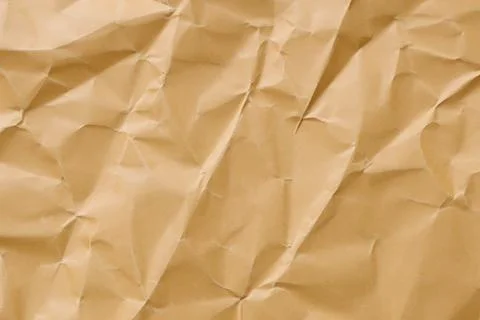 Brown crumpled paper texture. Abstract brown recycled paper background Stock Photos