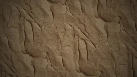 Brown crumpled paper texture background, with subtle light movement Video stock 347305113