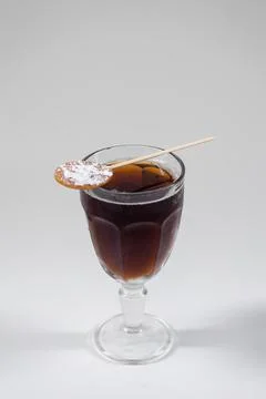 Brown cube libre cocktail with cola, brandy or rum or whiskey isolated on white Stock Photos