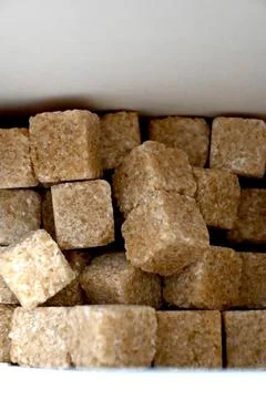 Brown cube sugar in a box Stock Photos