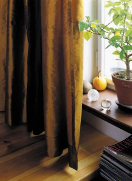 Brown curtains at the window with decorations Stock Photos