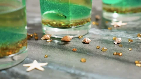 Brown Decorative Materials Scattered on Kitchen Bench Beside Wax Candles Stock Footage 307991686