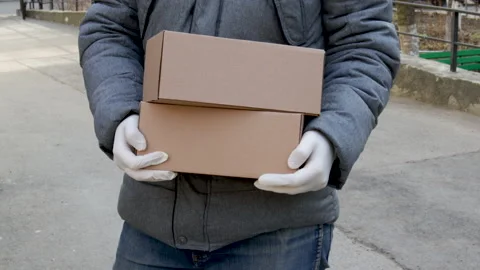Brown delivery box in hands Видео 171234861