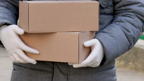 Brown delivery box in hands Stock Footage 171234954