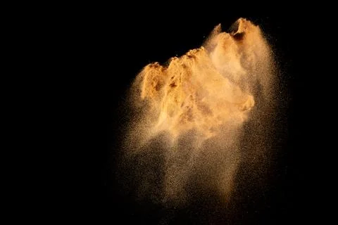 Brown dry river sand explosion isolated on white background. Stock Photos