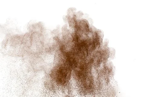 Brown dust exploding cloud.Brown particles splattered on white background. Foto stock