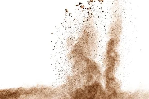 Brown dust explosion cloud.Brown particles splatter on white background. Stock Photos