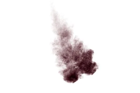 Brown dust explosion cloud.Brown particles splatter on white background. Stock Photos