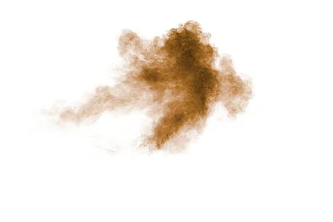 Brown dust explosion cloud.Brown particles splatter on white background. Foto stock