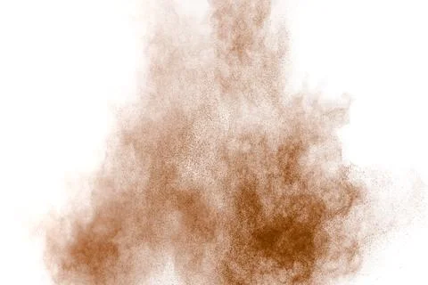 Brown dust explosion cloud.Brown particles splatter on white background. Stock Photos