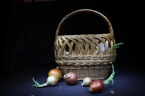 Brown easter basket with onions Stock Photos