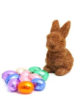 Brown easter bunny and chocolate eggs Stock Photos