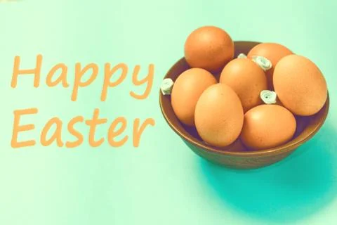 Brown Easter eggs lie in a plate on a blue background Stock Photos