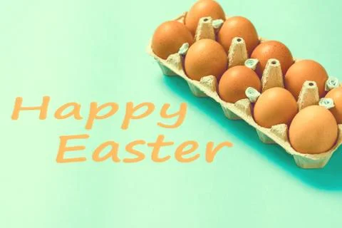 Brown Easter eggs lie in a plate on a blue background Stock Photos