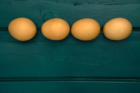 Brown ecological eggs on a green background 2 Stock Photos