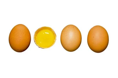 Brown eggs are lined in a row and egg yolk on a white background. Isolate Stock Photos