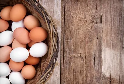 Brown eggs in a basket Stock Photos