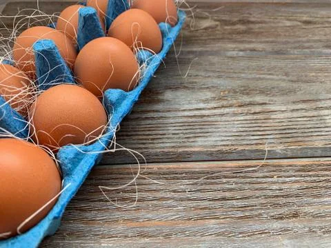Brown eggs in a blue box Stock Photos