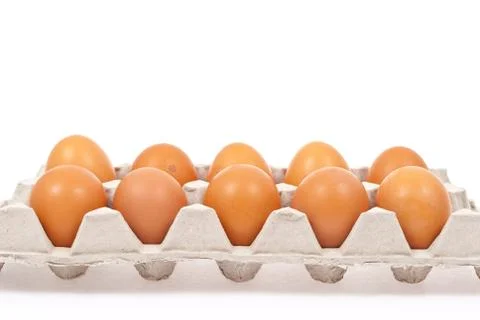 Brown eggs in box Stock Photos