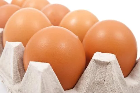 Brown eggs in box Stock Photos