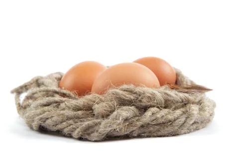 Brown eggs in canvas sack isolated on a white background Stock Photos