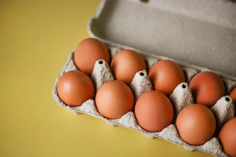 Brown eggs in eco packaging made from recycled materials Stock Photos